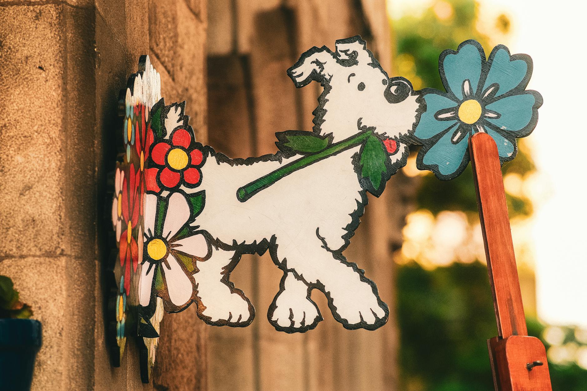 artistic dog sign with colorful flowers